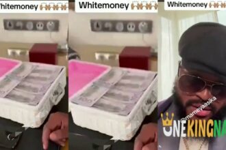 "I told you guys to make money"- Whitemoney says as he flaunts wads of 100 dollars note in a viral video (Watch)