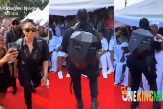 ‘’See person wey dey c@ll out Zubby michael’’- Netizens reacts as Actress Angela Okorie stuns many at Mr ibu’s funeral ceremony as he arrives in a robot-like outfit (VIDEO)