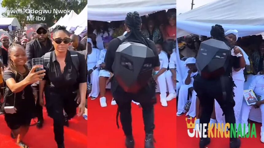 ‘’See person wey dey c@ll out Zubby michael’’- Netizens reacts as Actress Angela Okorie stuns many at Mr ibu’s funeral ceremony as he arrives in a robot-like outfit (VIDEO)